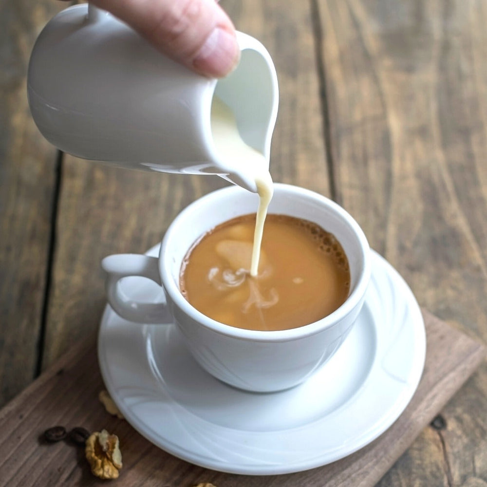 Adding Cream in 100% Kona Coffee
